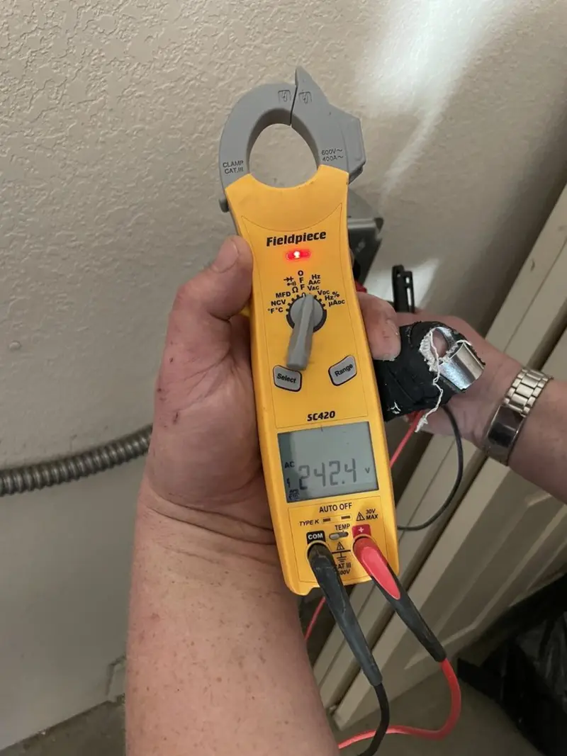 Voltage testing with clamp meter during Electrical Installation Services in Fleming Island